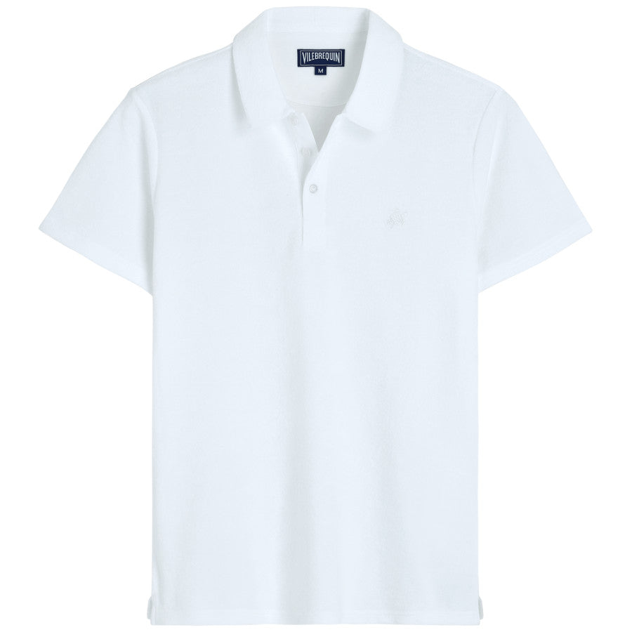 Discover the turtle emblem on the fresh Phoenix men's plain terry cloth polo shirt. Soft, cozy, and stylish, this short-sleeved essential features a buttoned placket and a front embroidered turtle. Perfect for any occasion, whether at the beach or in town. Details: Men Terry Polo Shirt. 3 buttons on front placket. Men polo with embroidered tone on tone on the chest. 86% Cotton organic - 14% Polyamide.
