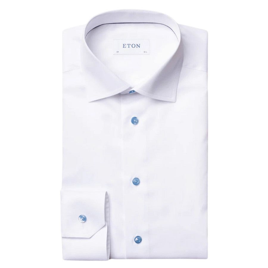 Suited for any occasion, this dress shirt is crafted from our beloved signature twill. It features updated piping inside the front placket and contrast buttons for a sophisticated, sleek look. The fabric's cotton creates a perfect balance between suppleness, structure, and luster. This iconic Eton material, perfected over two decades, is made to last. Wear it with or without a tie. Contrast buttons. Wrinkle-free, easy care. Perfect balance between structure and luster. Our most iconic fabric.
